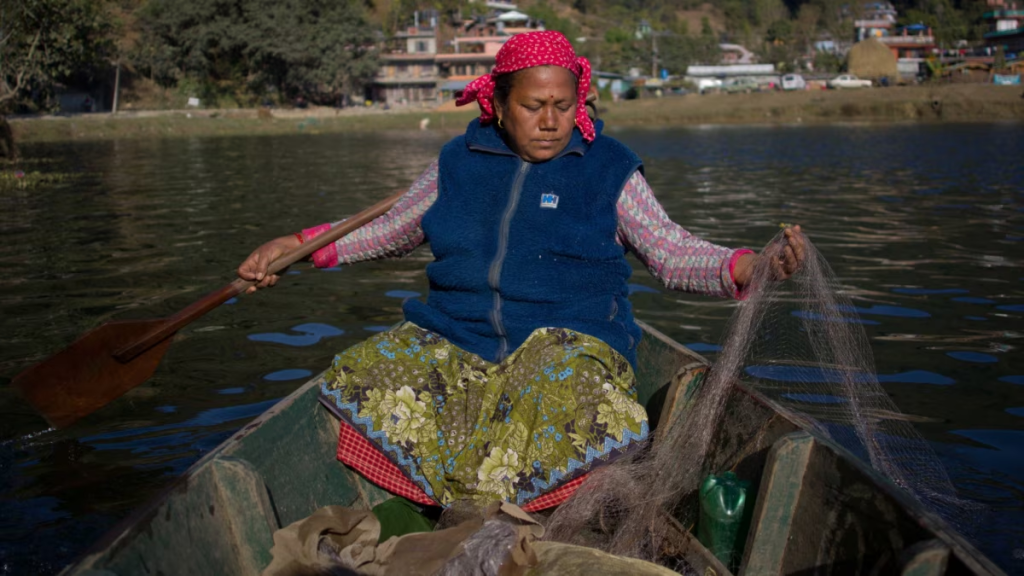Fisherwoman in a canoe in Namibia