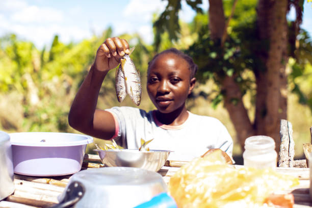 Girl holding fish in Namibia